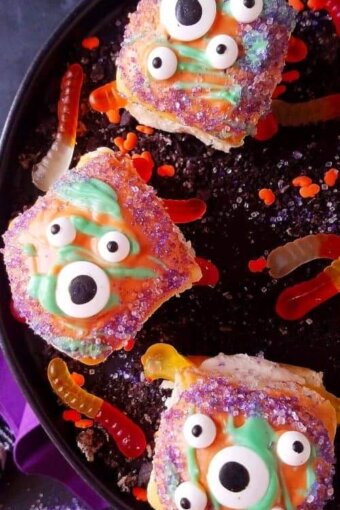 A close up of pumpkin bread rolls decorated for Halloween