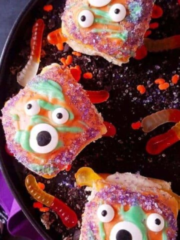 A close up of pumpkin bread rolls decorated for Halloween