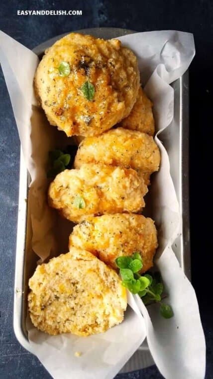 keto biscuits lined up onto a bread loaf pan