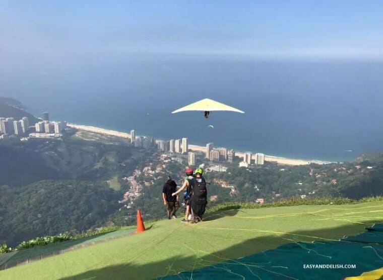 Planning to travel to the 'Wonderful City'? Take a peek of 20 Awesome Things to Do in Rio de Janeiro on a Budget. It'll make your eyes shine-bright! hang gliding on the Gavea rock -- one of the awesome things to do in Rio de Janeiro