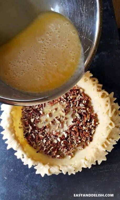 pouring Southern pecan pie filling