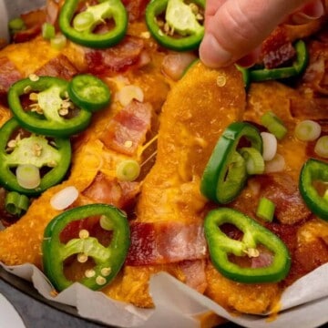 cropped-keto-nachos-loaded-chicken-holding-chicken-strip.jpg