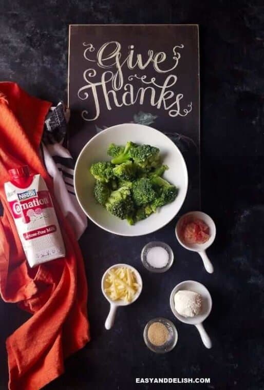 ingredients for broccoli au gratin on a table with "Give Thanks" sign on the back 