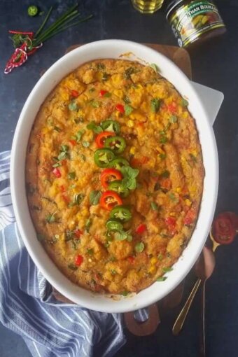 Mexican cornbread dressing casserole in a baking dish