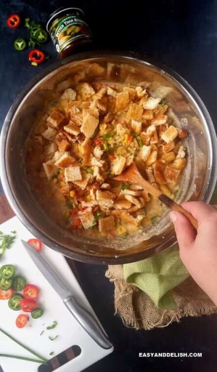 mixing bread and other ingredients in a bowl