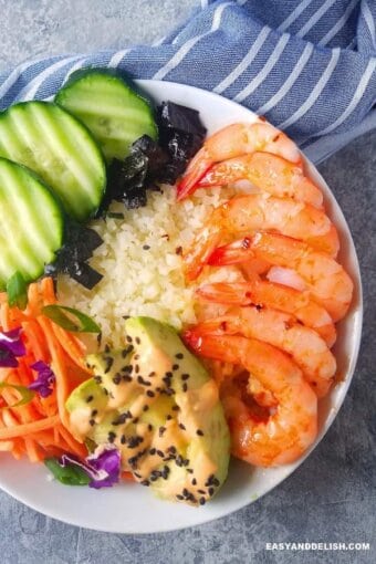 sushi bowl with a napkin on the side as one of our high protein meal preps for lunch