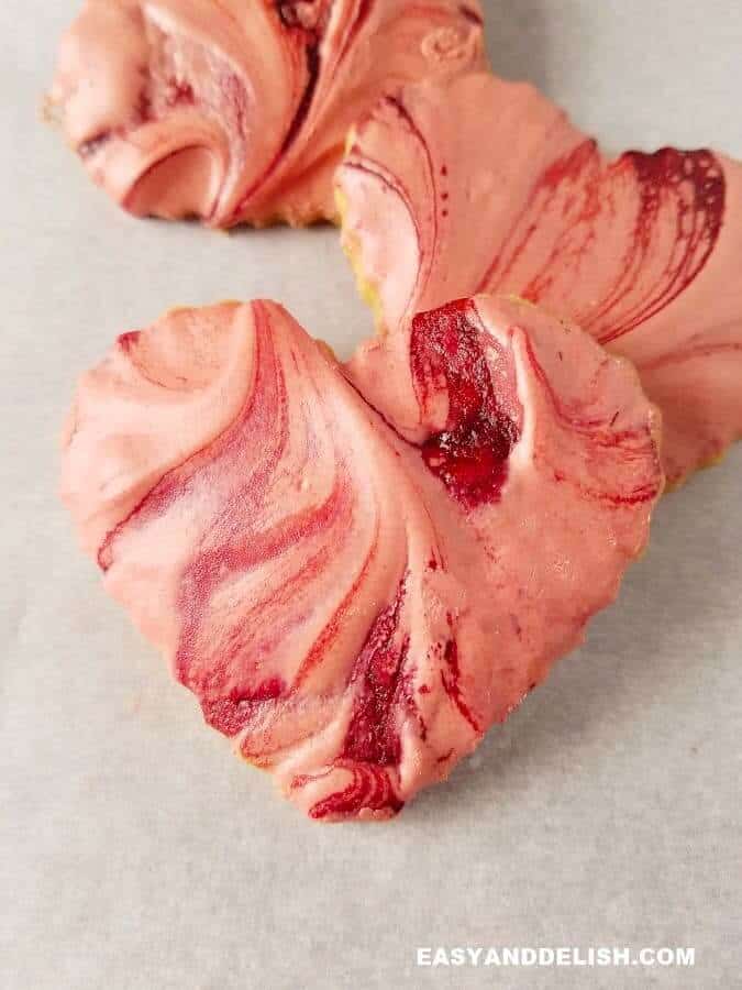 close up image of a hear-shaped shortbread cookie with icing