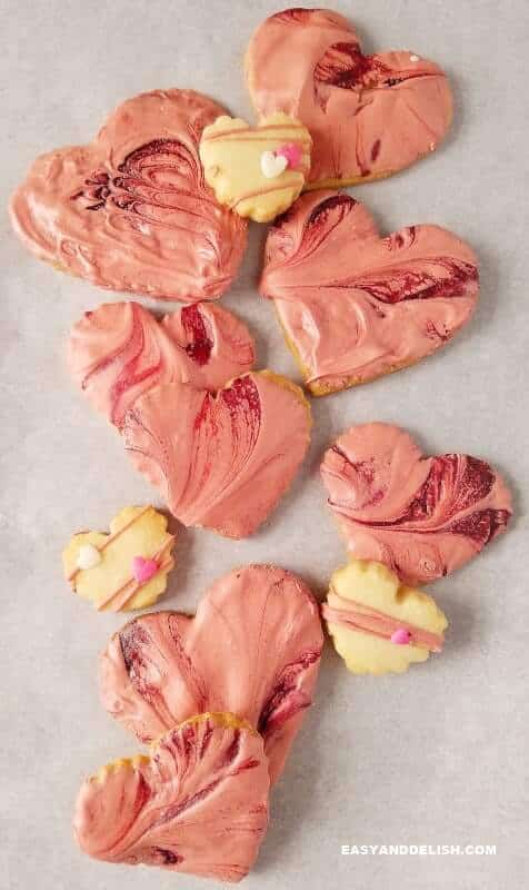 several shortbread cookies with icing over a table 