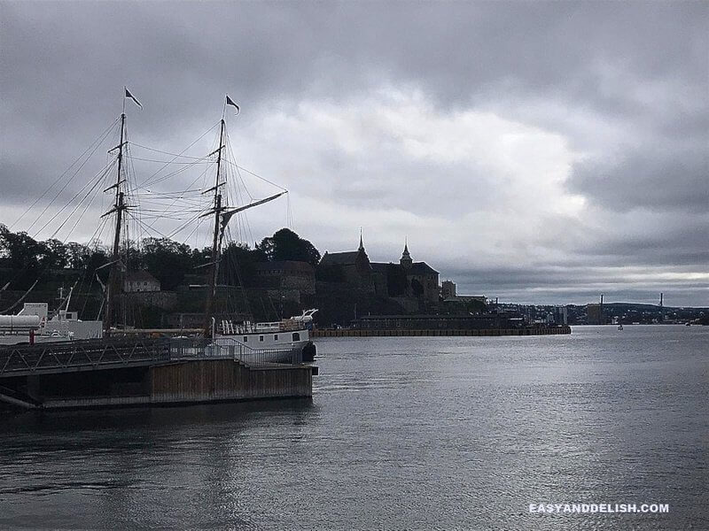 Oslo Harbour with Arkeshus Fortress on the background -- one of the things to do in Norway on a budget