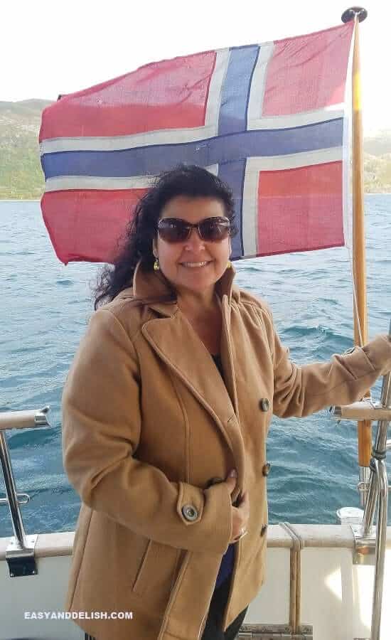 a woman with a Norwegian flag on the background