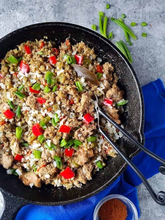 Cajun dirty rice with garnish on the side