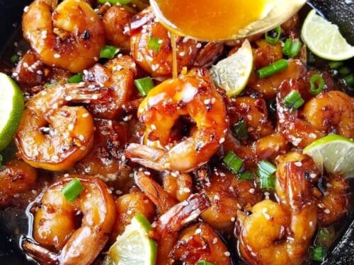 https://www.easyanddelish.com/wp-content/uploads/2020/02/Honey-Garlic-Butter-Shrimp-Skillet-Recipe-pouring-sauce-500x375.jpg