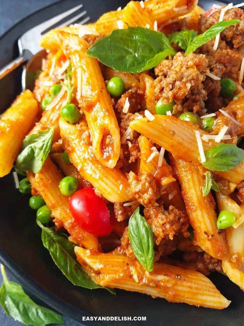 half bowl of pasta with meat sauce