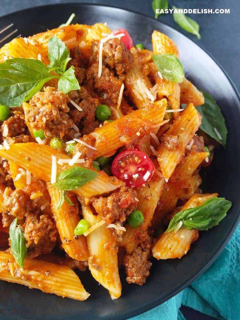 half bowl of pasta and fresh basil