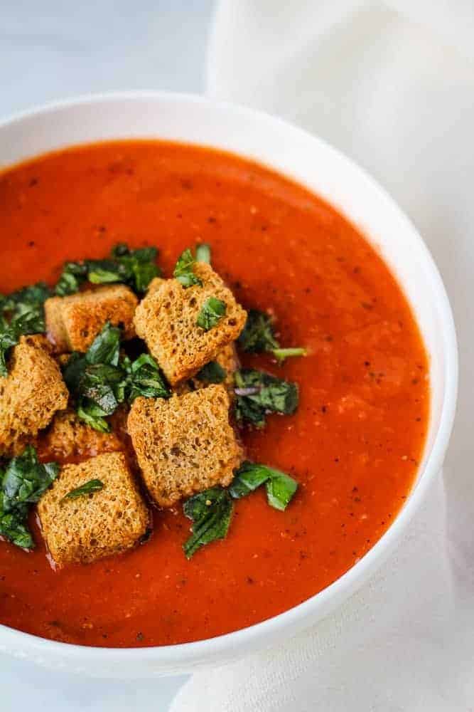 a bowl of tomato soup with croutons for our 35 pantry recipes 