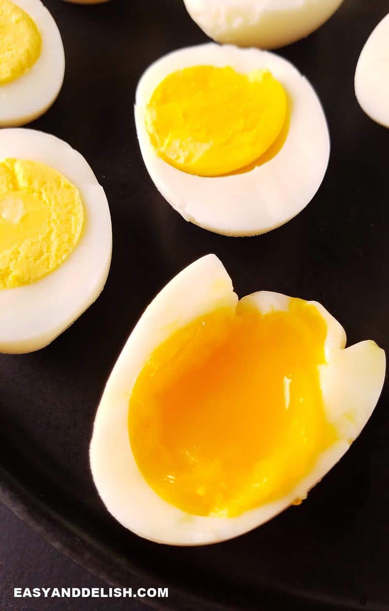 A close up of a tray with boiled egg halves