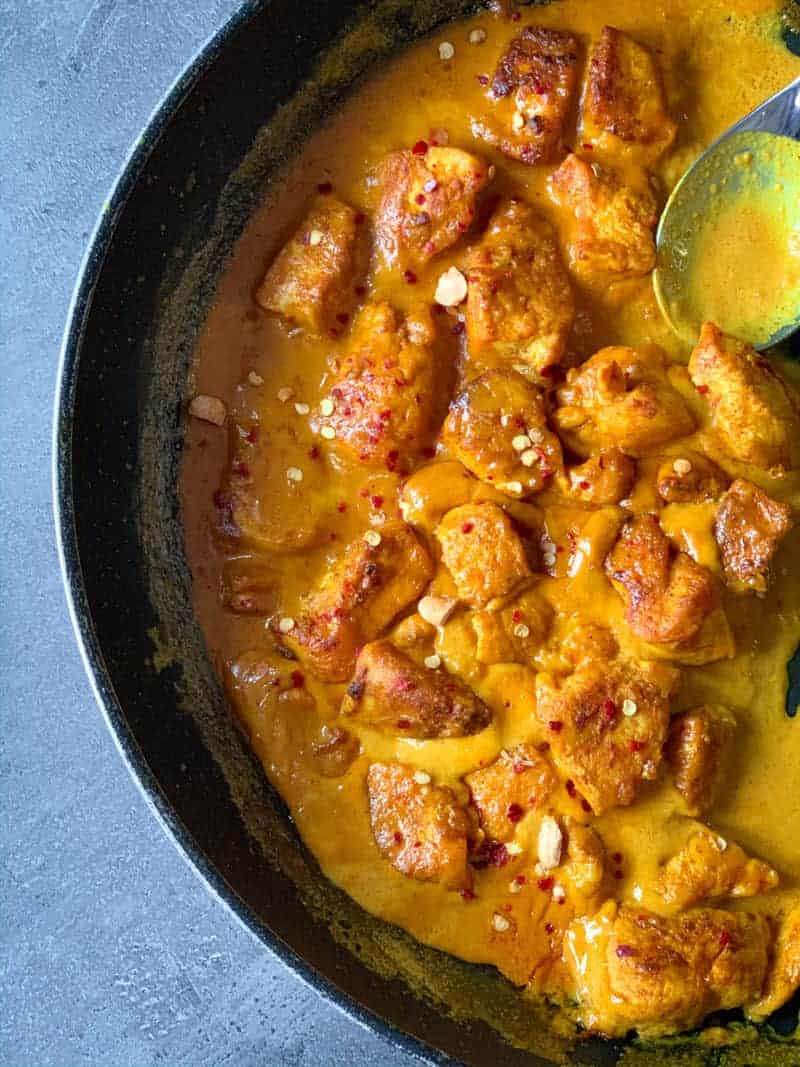 a skillet of chicken in peabut bitter sauce -- one of our quick and easy low carb dinner recipes