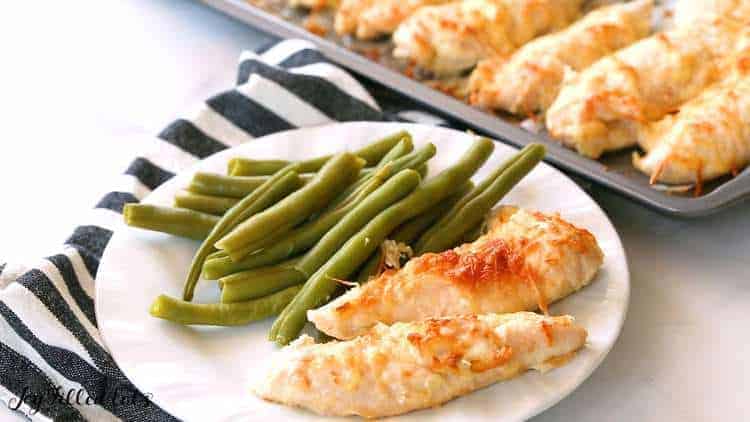 chicken tenders with green beans in a plate