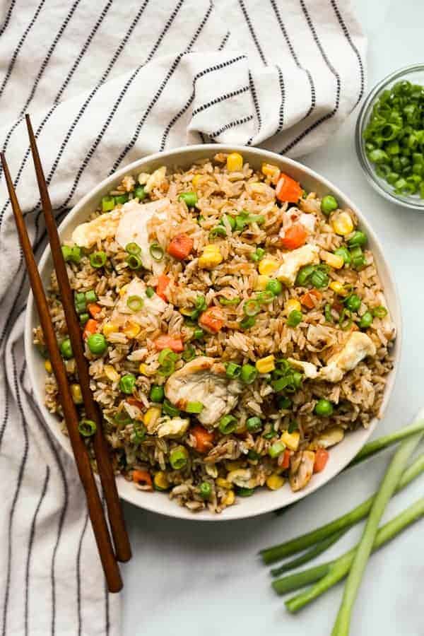 chicken fried rice in a bowl with chopsticks on the side as one of easy one pot meals for dinner