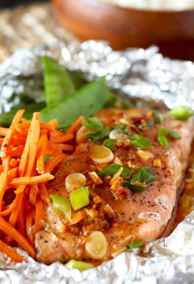 salmon in foil with veggies for one of our best one-pot meals for dinner made in a sheet pan. 