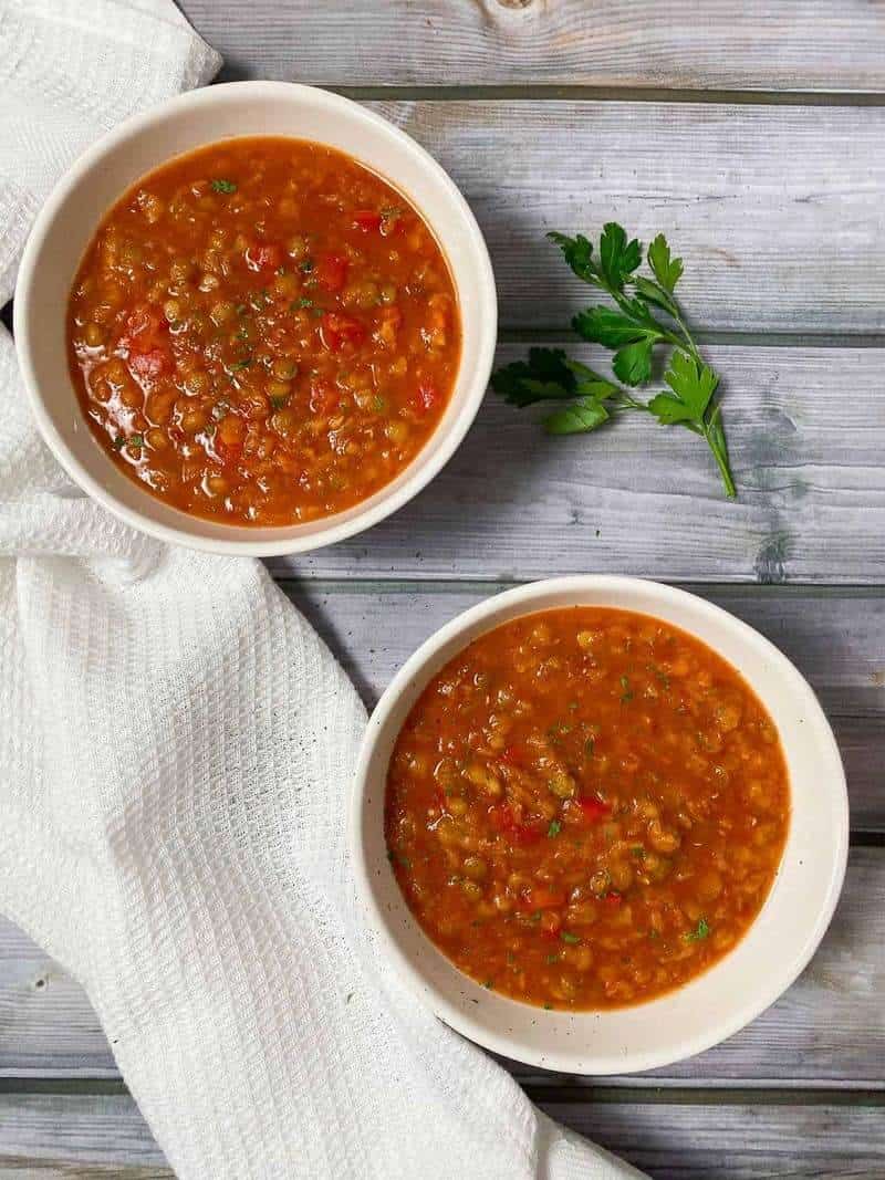 2 bowls of vegan sloppy joe's with an herb on the side as one of healthy one-pot meals for dinner.