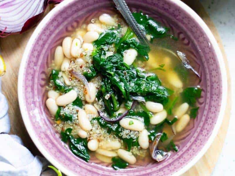 a bowl of vegan white bean soup as one of the 70 easy one pot meals 