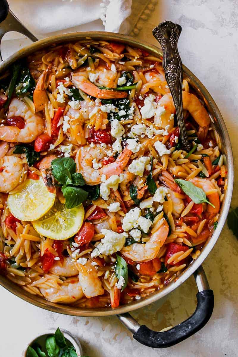 harissa shrimp with orzo in a skillet as one of the 70 easy one pot meals