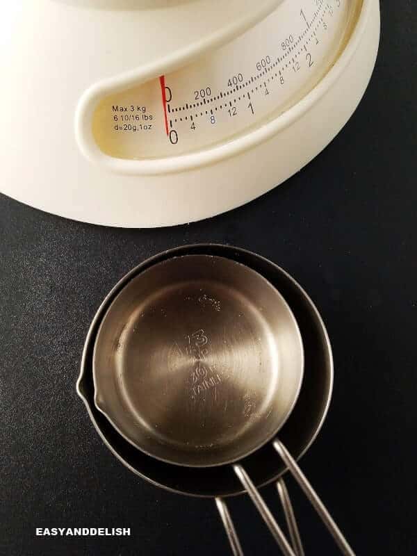 a kitchen scale and measuring cups for measuring cups to ounces to grams