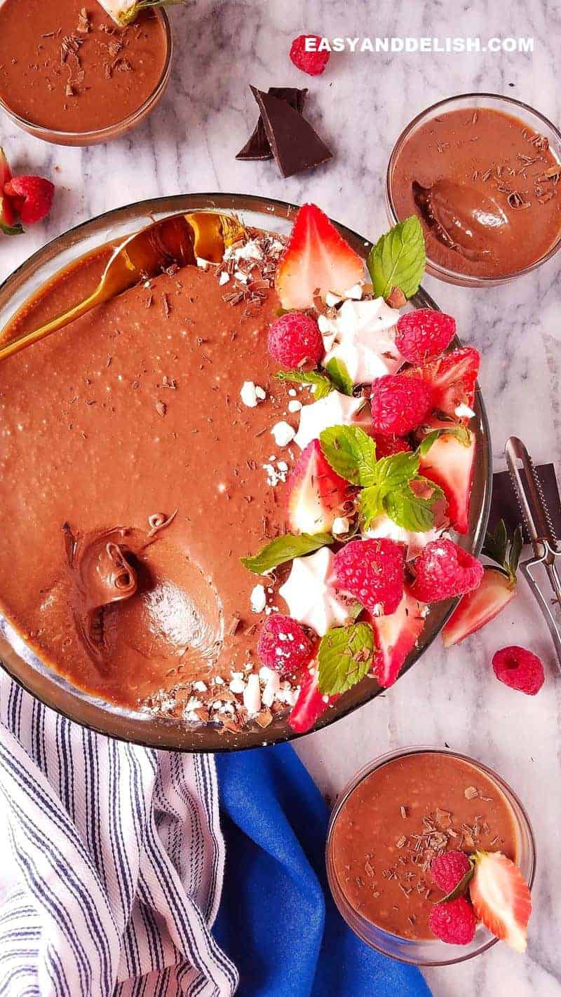 several bowl of chocolate mousse with berries