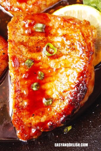 close up of one of the pan seared pork chops