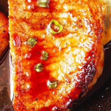 close up of one of the pan seared pork chops