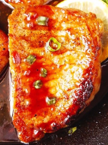 close up of one of the pan seared pork chops
