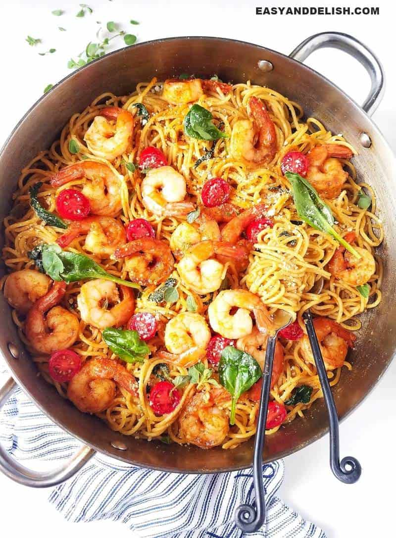 pasta in a pan with cutlery on the side