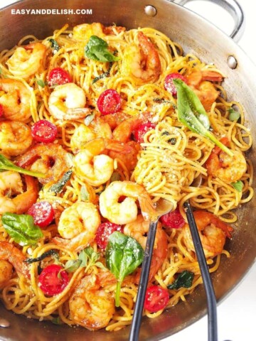 close up of garlic shrimp spaghetti in a pan