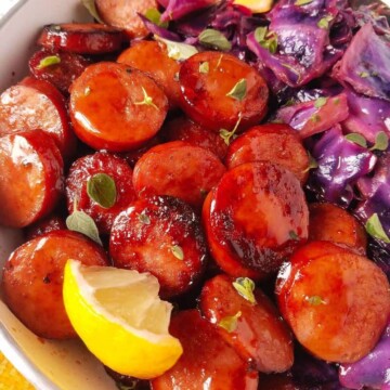 close up of cabbage and sausage in a skillet