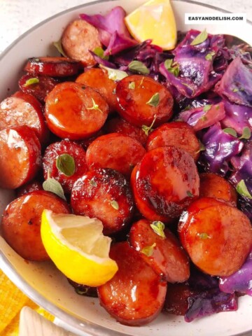 close up of cabbage and sausage in a skillet