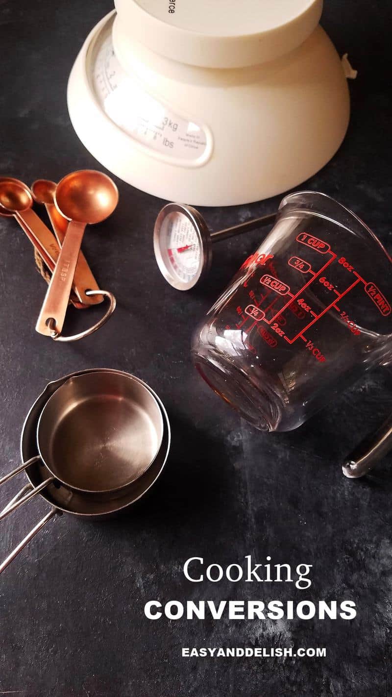 several cooking conversions tools such as scale, measurement cups and spoons, thermometer, etc