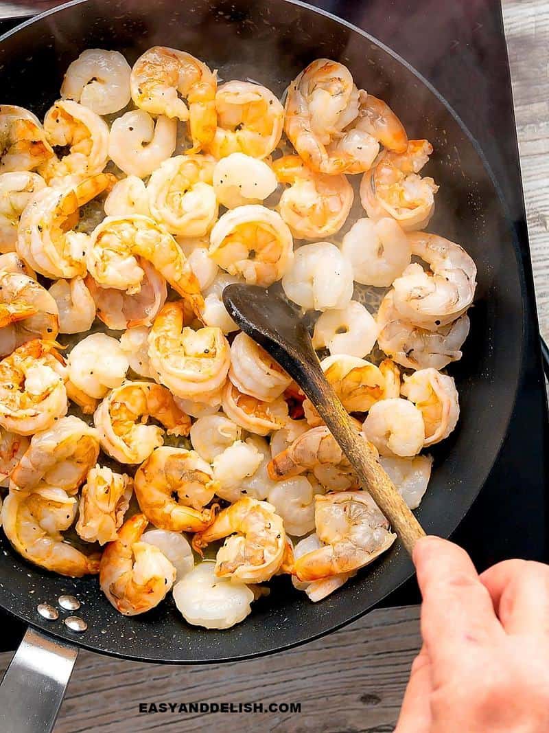 shrimp being cooked in a pan