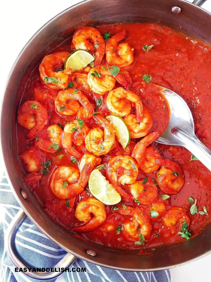 one pan with camarones a la diabla and one spoon on the side