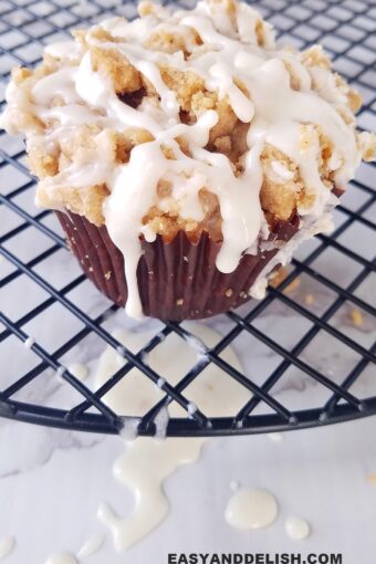 one of the cinnamon muffins over a rack