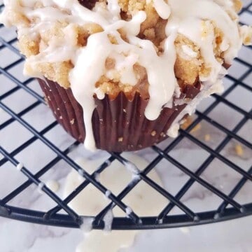 one of the cinnamon muffins over a rack