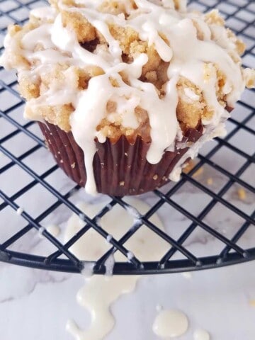 one of the cinnamon muffins over a rack