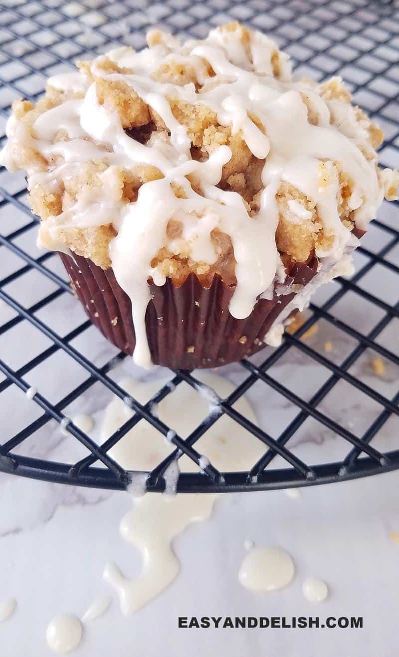 one of the cinnamon muffins over a rack