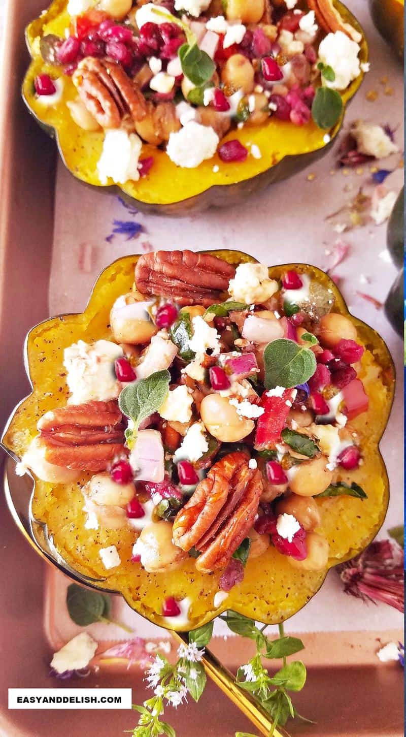 2 halves of cooked vegetable filled with the salad on a tray