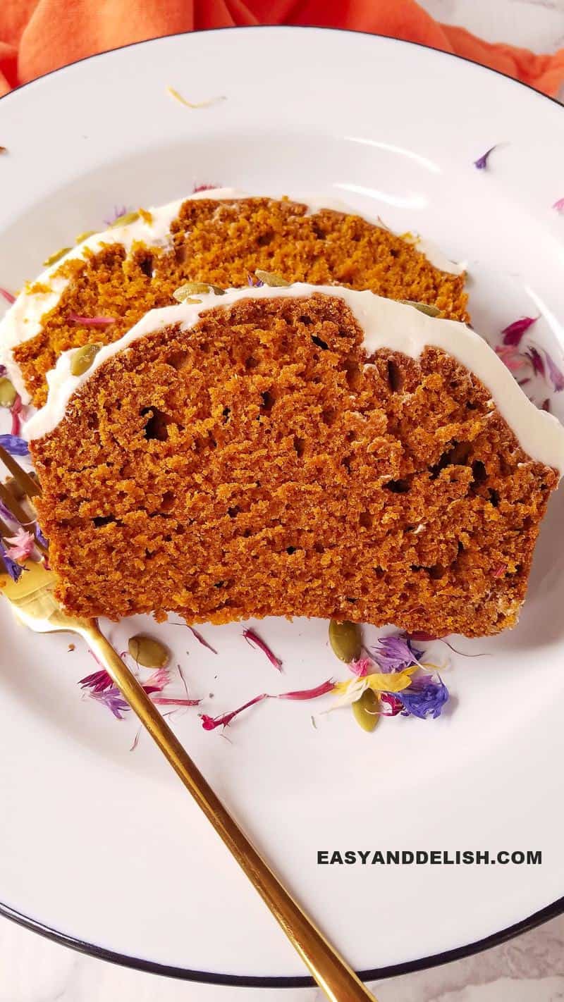 two slices of the loaf on a plate with fork on the side