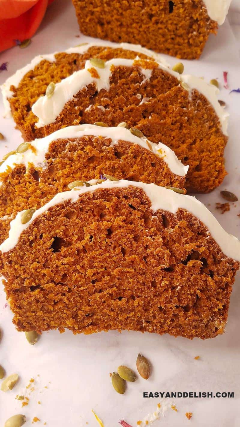 several slices of easy pumpkin bread on a row