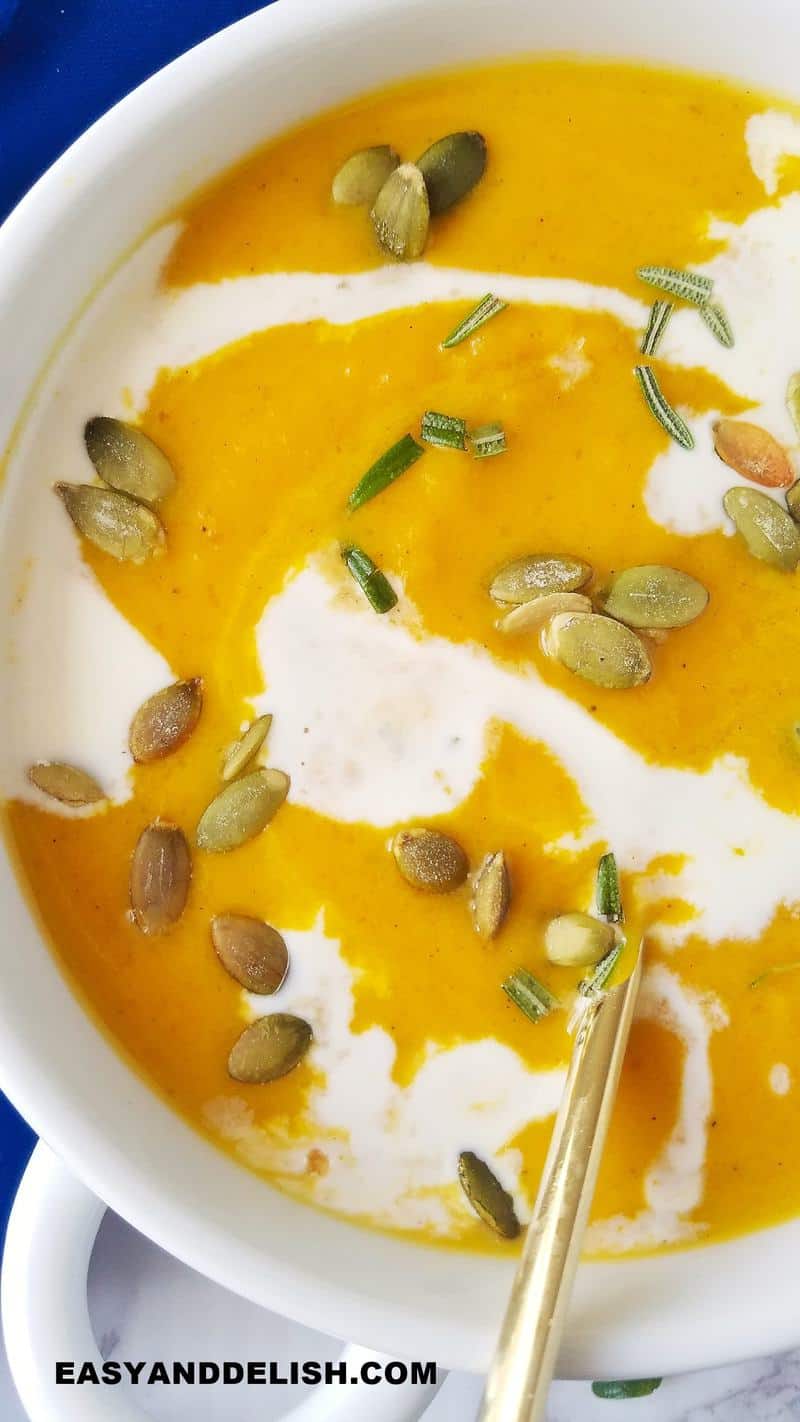 close up of Panera Autumn squash soup in a bowl ass one of our easy soup recipes