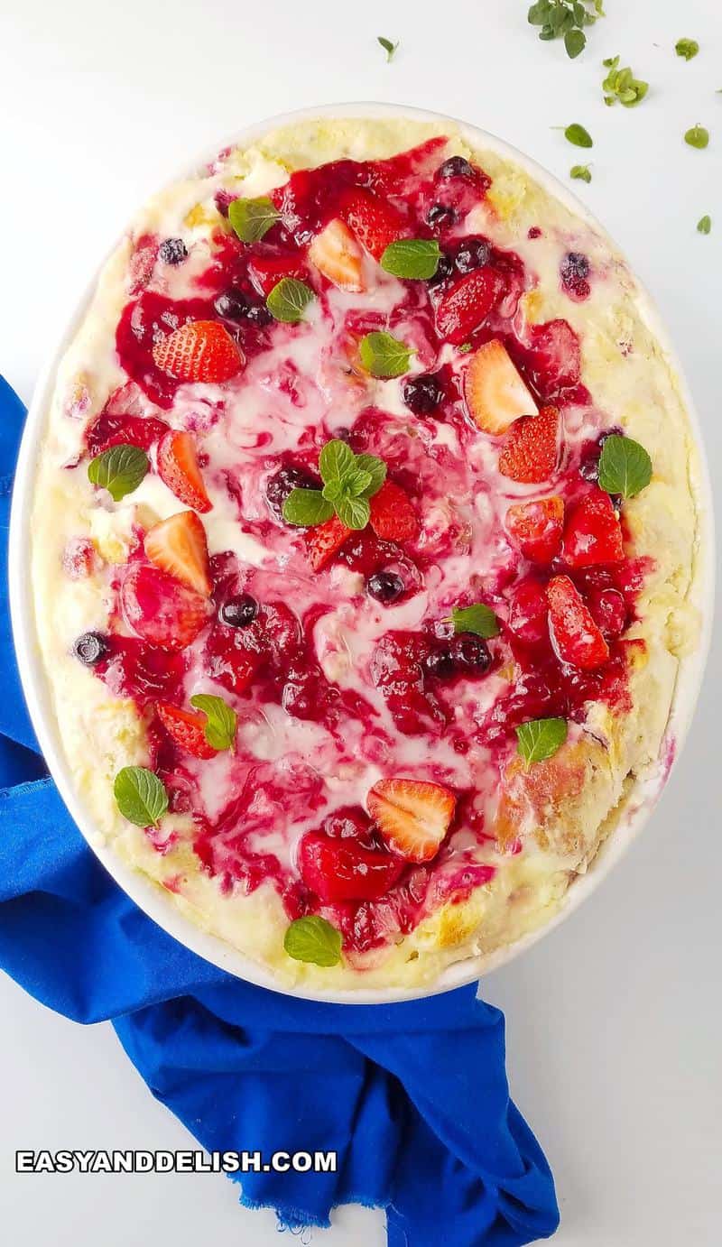 overnight breakfast in a baking dish with chopped herns on teh side