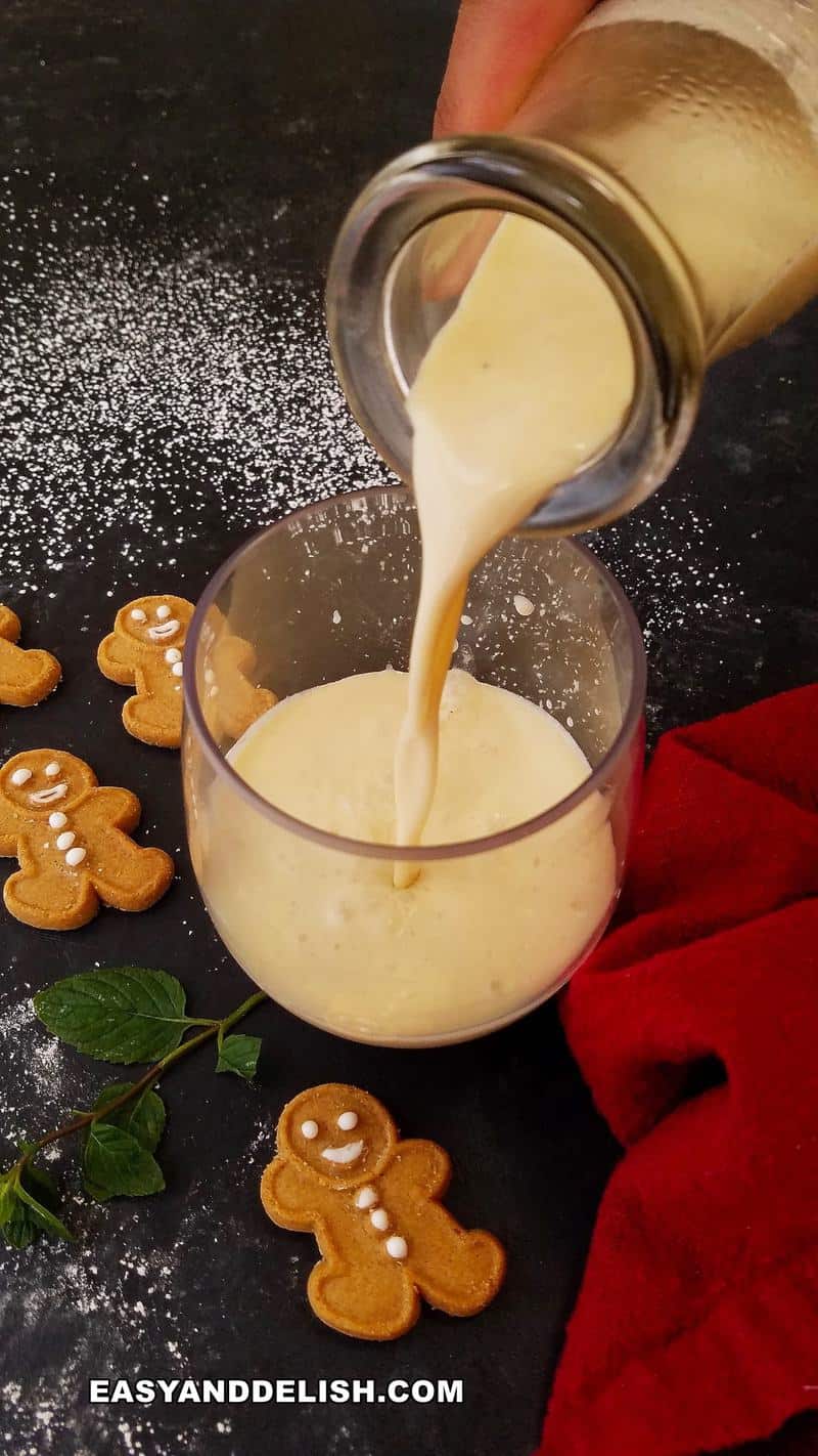 Christmas cocktail being poured in a glass