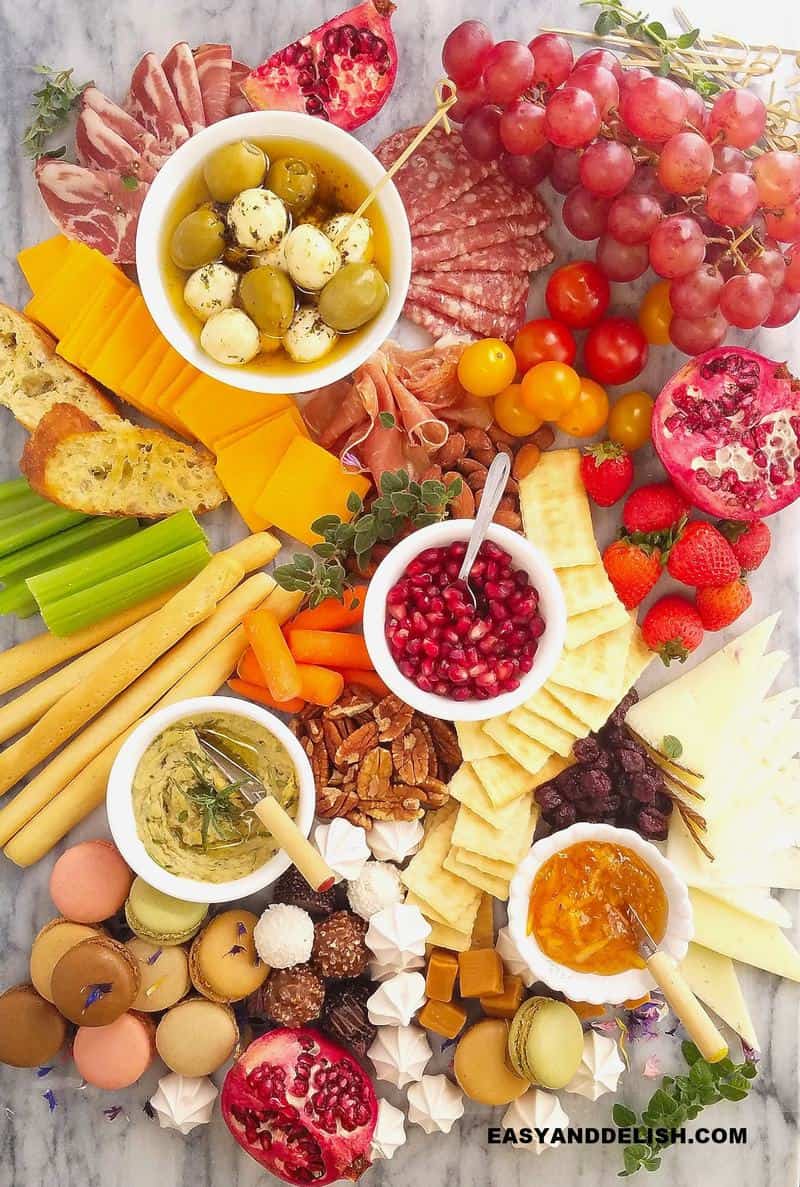 close up of an easy charcuterie board with appetizers and mini desserts